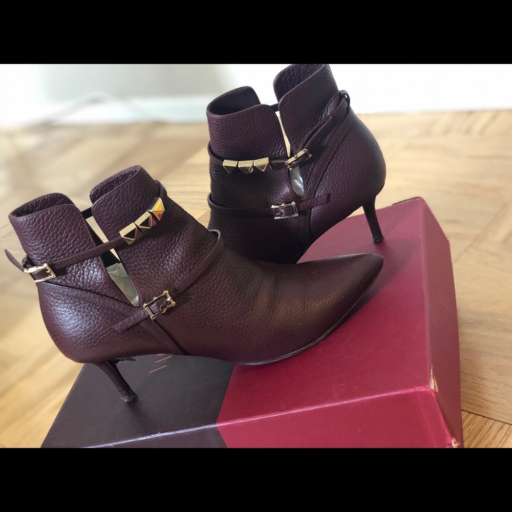 Valentino studded ankle boots with gold studs.